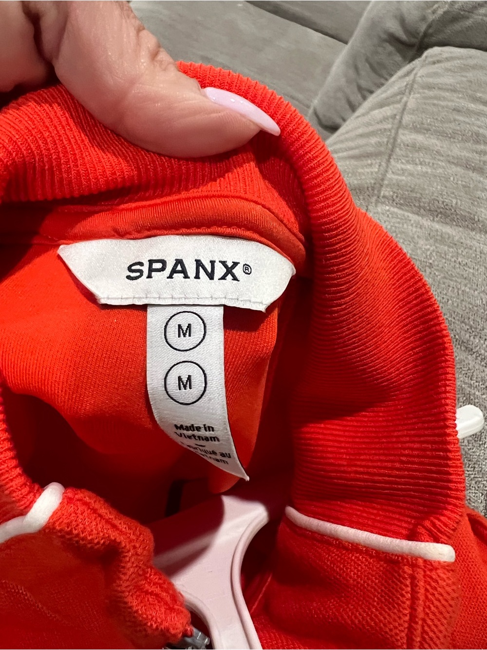Sleeveless SPANX Air Essentials jumpsuit  in Bright Orange with White Piping - Picture 6 of 6